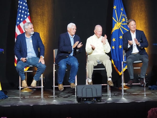 Indiana’s four living governors — from left: Eric Holcomb, Mike Pence, Mitch Daniels and Evan Bayh — gathered onstage Wednesday during a leadership panel at the Indiana State Fair. (Photo: Whitney Downard of Indiana Capital Chronicle)