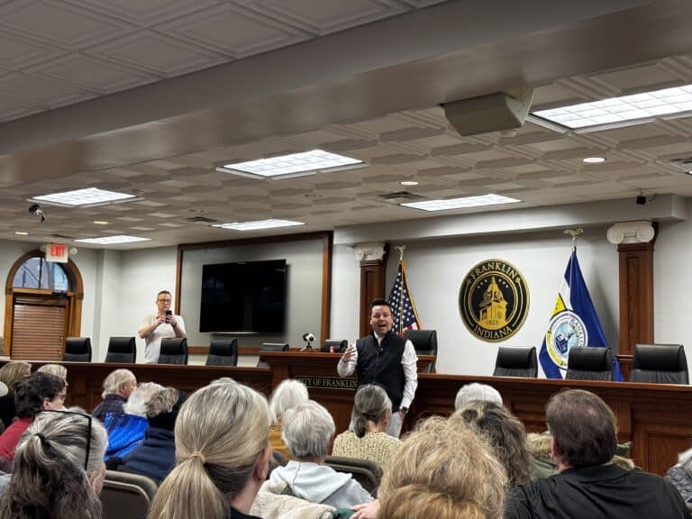 Lt. Gov. Micah Beckwith stands before a passionate group of Hoosiers concerned about issues ranging from school vouchers to immigration at a town hall in Franklin, Ind. on March 31, 2025. (Photo/Juliann Ventura)