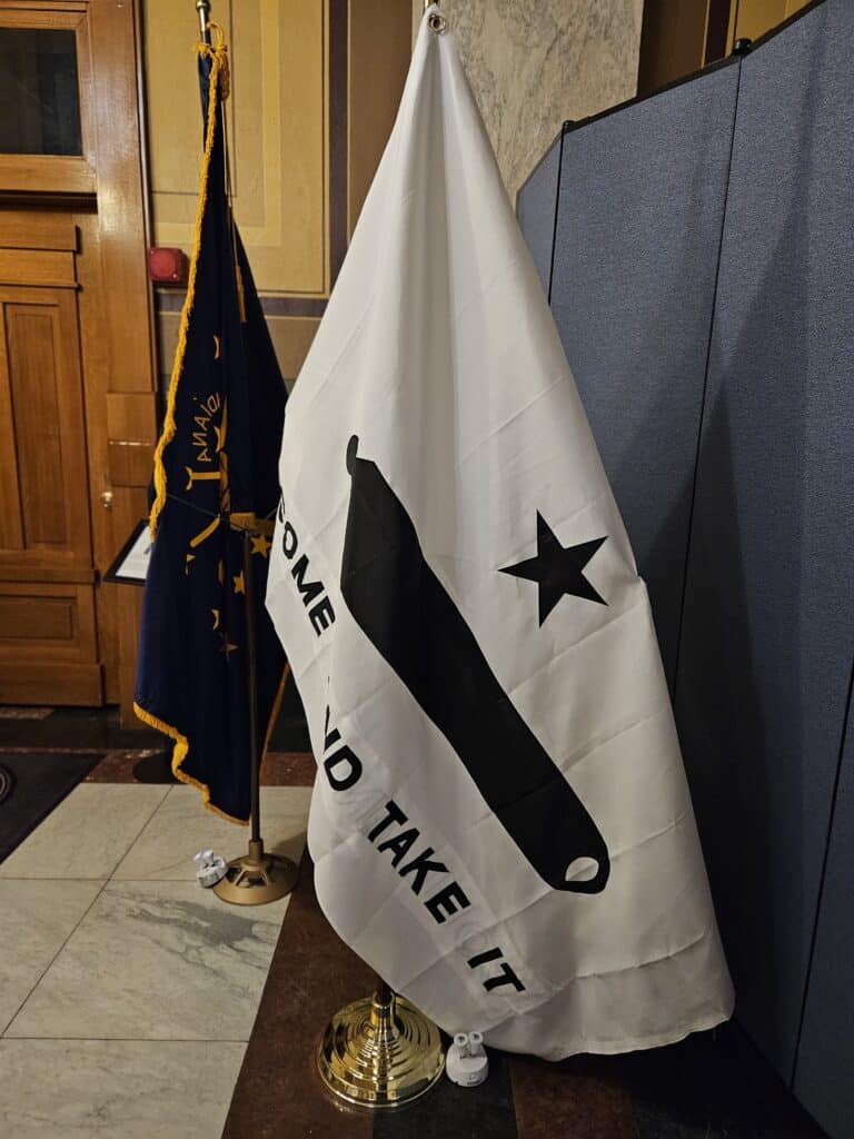 A “Come and Take It” flag stands outside of Indiana Attorney General Todd Rokita’s office in the Statehouse. (Photo/Marilyn Odendahl)