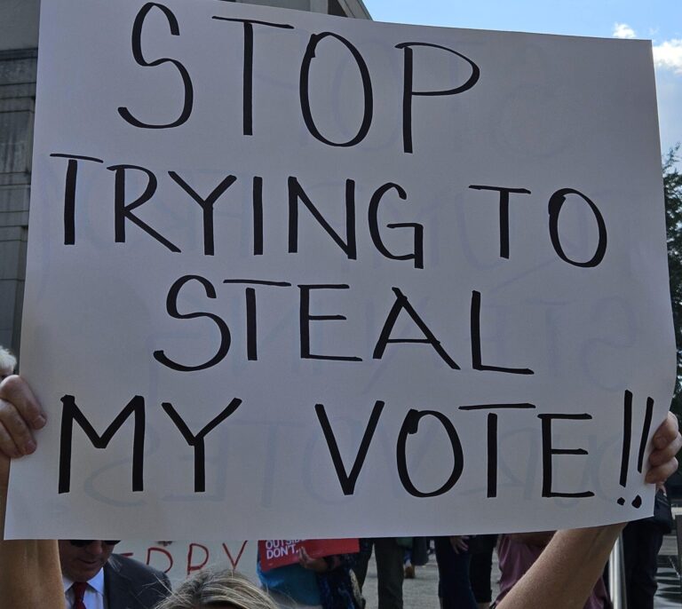 Voting-rights advocates, lawmakers and concerned citizens protested at the Statehouse the push for mid-decade redistricting. (Photo/Marilyn Odendahl) 