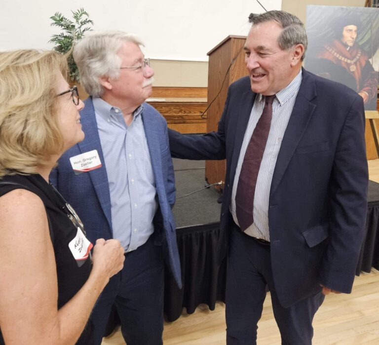 Former Vatican ambassador Joe Donnelly (right) talked with former Indiana Attorney General Greg Zoeller and his wife, Kerrie, after the St. Thomas More Society of Central Indiana Red Mass in Indianapolis on Monday. (Photo/Marilyn Odendahl)