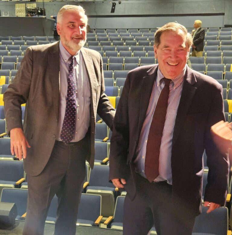 Former Indiana Gov. Eric Holcomb (left) and former U.S. Sen. Joe Donnelly greeted friends after their discussion at Marian University on Sept. 25. (Photo/Marilyn Odendahl)