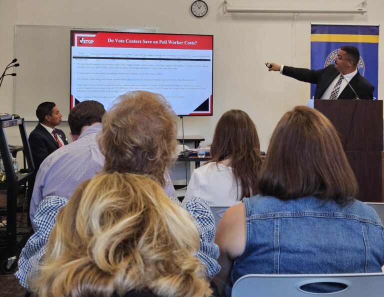Matt Housley, of the Voting System Technical Oversight Program at Ball State University, explained his analysis during the election study meeting in Indianapolis this week. Indiana Secretary of State Diego Morales (far left) watched the presentation. (Photo/Marilyn Odendahl) 