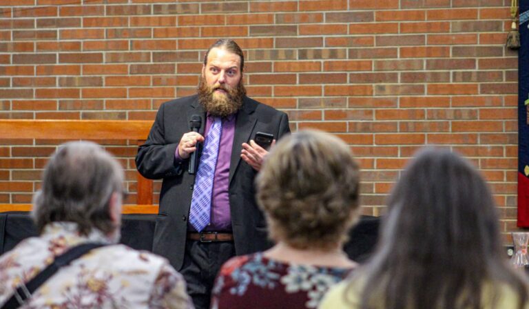 Secular Education Association co-founder Zachary Parrish shared his personal experience with LifeWise and how that affected his daughter in third grade. Parrish said at the end of the night, “Whether you’re religious or not, public schools belong to everyone. The question is how to protect that space so every kid feels safe and respected.” (Photo/Sydney Byerly)