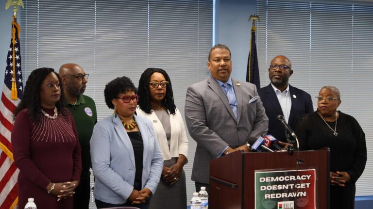 Surrounded by members of the Indiana Black Legislative Caucus, Rep. Earl Harris Jr., chair of the IBLC, warned mid-decade redistricting would dilute minority votes. (Photo/Courtesy Indiana House Democratic Caucus)