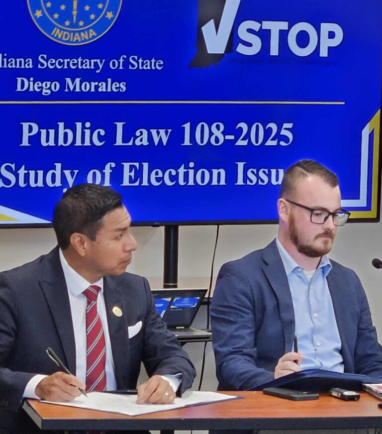 Indiana Secretary of State Diego Morales (left) and Kegan Prentice, SOS legislative director, took notes during the presentation at the election study meeting held in Indianapolis in September. (Photo/Marilyn Odendahl) 