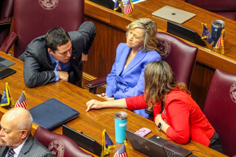 Republican lawmakers talked amongst themselves during Friday’s debate and vote on the redistricting bill. (Photo/Sydney Byerly)
