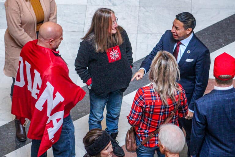 Indiana Secretary of State Diego Morales talked to constituents during the Turning Point Action rally at the Statehouse in December. (Photo/Sydney Byerly)