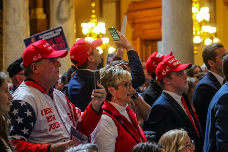 Supporters of redistricting, wearing Trump-inspired baseball caps and jerseys,  joined the Turning Point rally at the Statehouse on Friday as the House voted to pass the new congressional map. (Photo/Sydney Byerly)