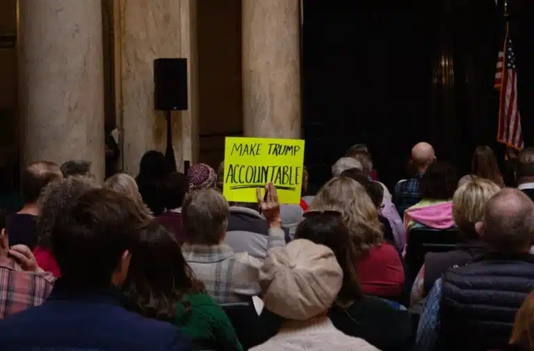 A supporter holds a sign up above the crowd during the Faith in the Face of Fear rally, which was held at the Indiana Statehouse on Jan. 9, 2026. (Photo/Wynn Wellington of TheStatehouseFile.com)