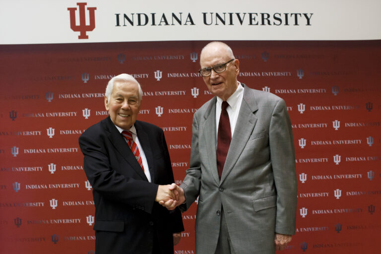 Former U.S. Rep. Lee H. Hamilton (right) and former U.S. Sen. Richard Lugar shook hands after an announcement in Indianapolis naming the Hamilton Lugar School of Global and International Studies in October 2018. (Photo/Courtesy of Indiana University)