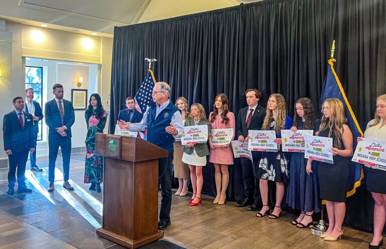 Gov. Mike Braun was flanked by officials and students as he announced his administration’s partnership with Turning Point USA. (Photo/Sydney Byerly)