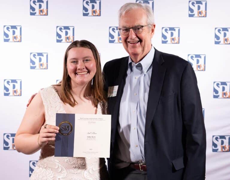 The Indiana Citizen reporter Sydney Byerly, pictured with publisher Bill Moreau, received an SPJ award for her work on the “One Heartbeat Away” project. (Photo/supplied)