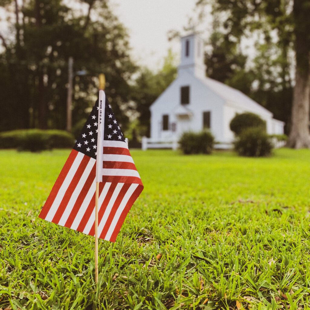 American flags in front of a church